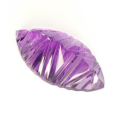 null Amethyst crystal of gem quality carved following rectilinear and parallel stripes....
