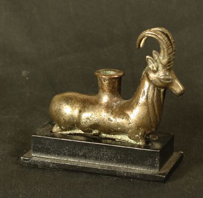 null Plastic ointment vase in the shape of an ibex in silver bronze. He is lying...