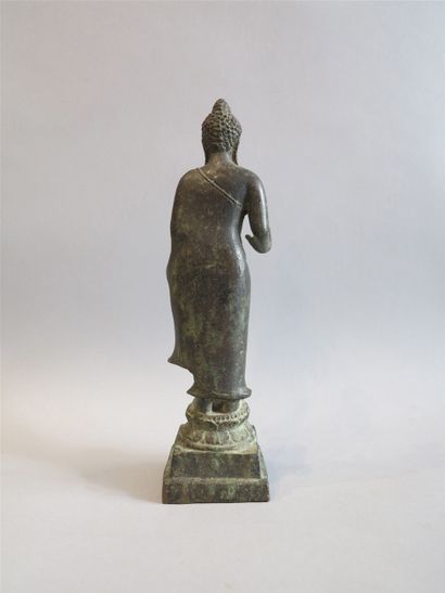 null Buddha represented standing on a double circular lotiform base placed on a pedestal...