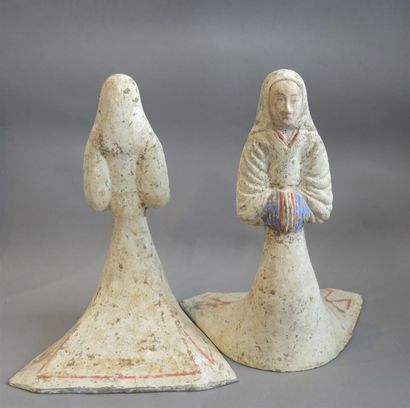 null Pair of court ladies dressed in a long dress with their hands hidden in the...