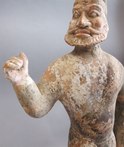 null Caravaneer in polychrome terracotta with his arm raised, camped in full action,...