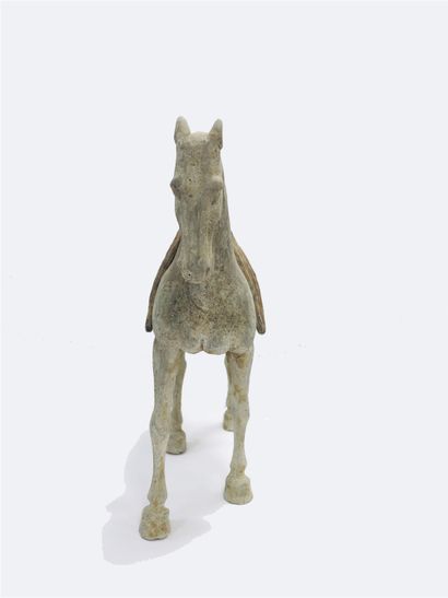 null Horse shown at a standstill with all four legs on the ground. Removable saddle....