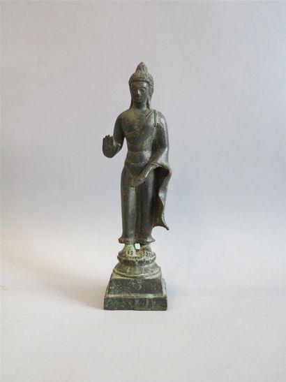 null Buddha represented standing on a double circular lotiform base placed on a pedestal...