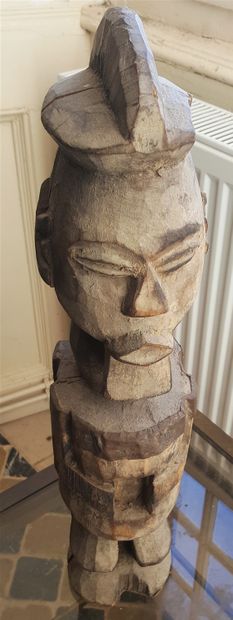 Wooden fetish statue of a bearded Janus man....