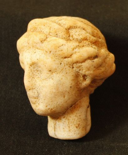 Marble head with yellow patina in depth of...