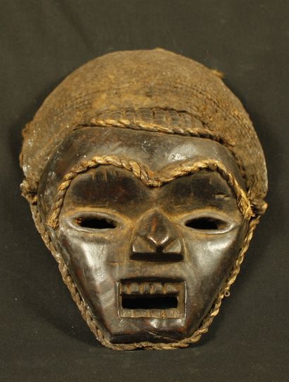 Wooden mask, a cord underlines the eyebrows,...