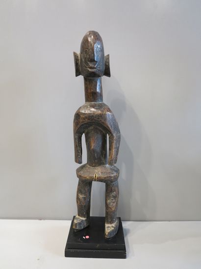 Anthropomorphic statue in wood with brown...