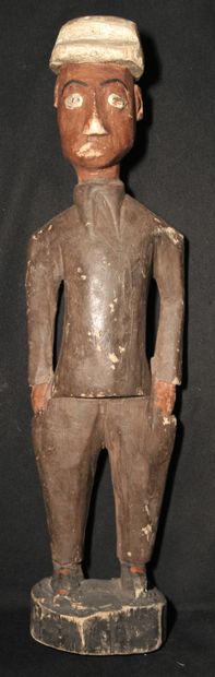 Wooden statuette representing a settler dressed...