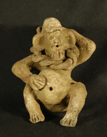 null Terracotta statuette of a bearded character with a bulging belly carrying a...