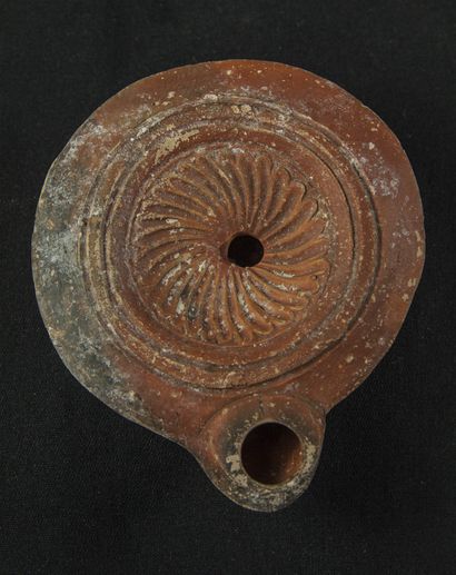 Red terracotta oil lamp with heart-shaped...