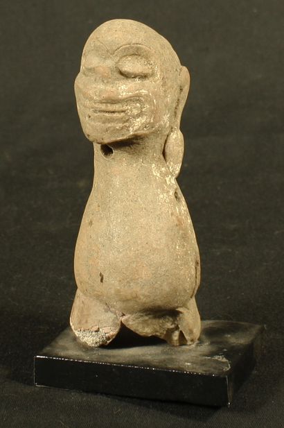 null Terracotta ocarina, stylized human trunk topped by a grotesque head. 
Classical...