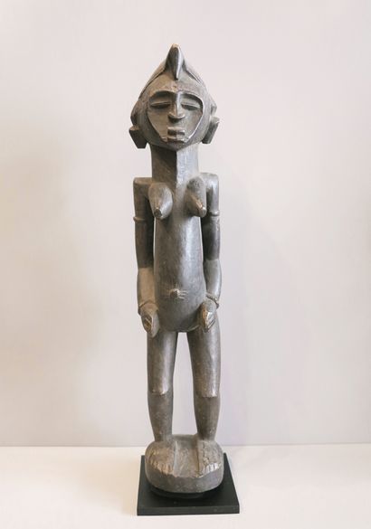 Female statuette represented standing on...