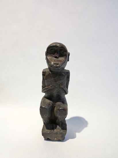 Statuette of a monkey with a prognathic face...