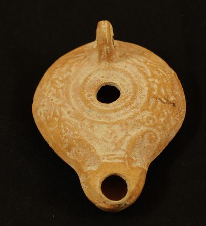Oil lamp in terra cotta decorated with olive...