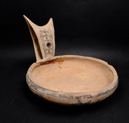 null Cup with horned handles and abstract geometric decoration.
Beige terracotta...