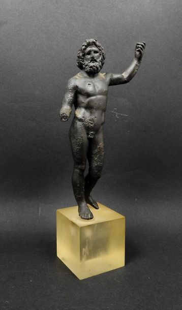 null God Zeus with his left arm up, Greek bronze style with his right hand missing,...
