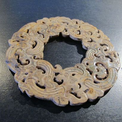 null Huan" disc ring with openwork dragons and phoenixes intertwined. Translucent...