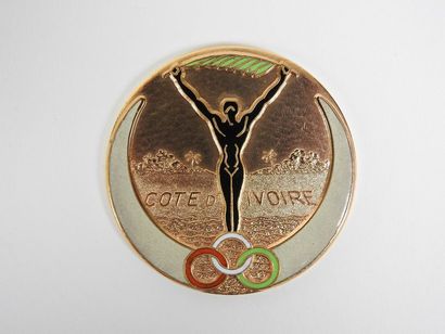 null Médaille commémorative (ronde dorée) des jeux d'Abidjan 1961: Athlète brandissant...