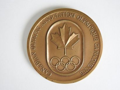 null MONTREAL
Bronze medal commemorating the Games. Reverse; maple leaf and rings...