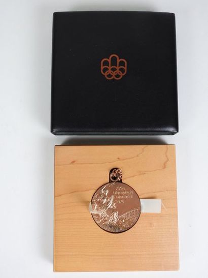 null MONTREAL
Bronze Winner's Medal in its case (clawed) and on its maple wood display,...