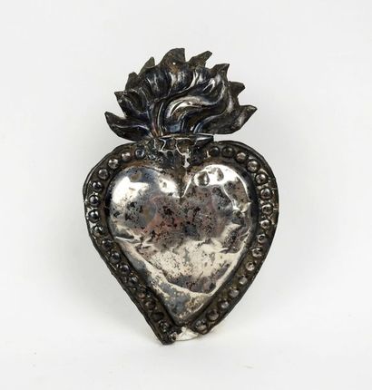 null Ex voto representing a flamboyant heart

Silver plated metal 14 cm

eighteenth...