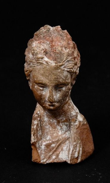 Thin female bust. Terracotta. Greek style....