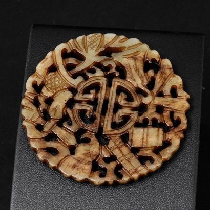 Openwork medallion decorated with signs of...