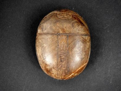 null Large heart beetle, decorated with hieroglyphs in three columns

Stone 6.7 cm

Ancient...