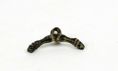 Pendant in the shape of a double phallus

Bronze...