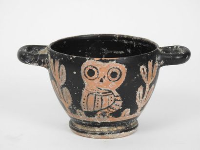 null Skyphos decorated with owls on both sides framed with olive branches symbolizing...