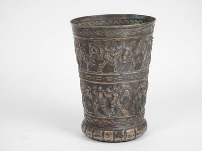 null Tulip-shaped bowl with a gadrooned base decorated with two registers of quadrupeds,...