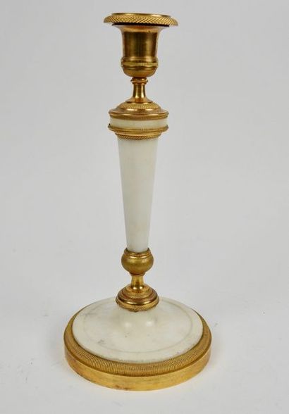 null Candlestick in chased and gilded bronze resting on a circular base.
Marble shaft
H...