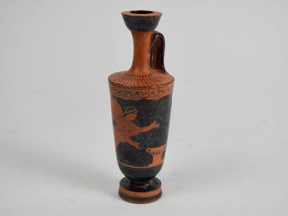 null Terracotta lekythos with shiny black slip with red
figures Flying winged goddess...