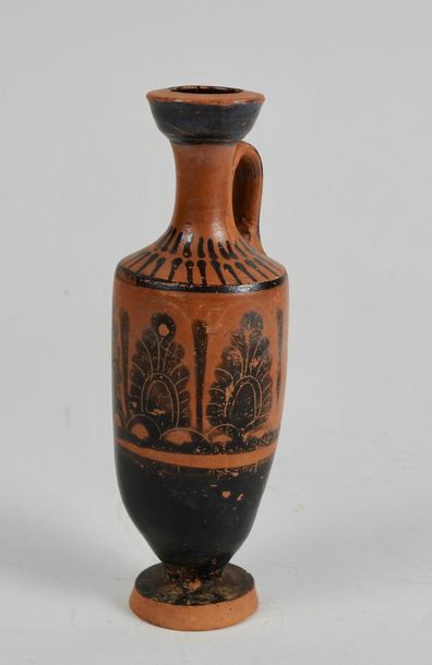 null Terracotta lekythos with black slip decorated with palmettes and tears on the...