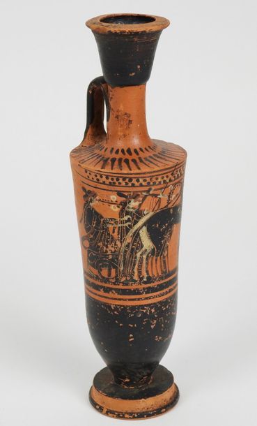 null Terracotta lecithus with black-figure engobe.chariot driven by a character.another...