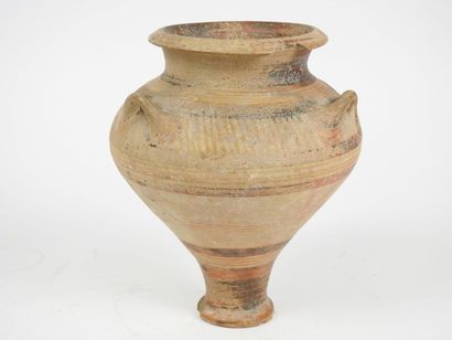null Terracotta vase with small handles and long foot with geometrical
decoration...