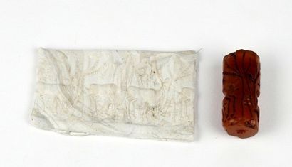 null Engraved cylinder seal of an animal scene with deer

Agate or carnelian 3.2...