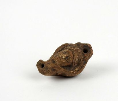 null Miniature antropomorphic oil lamp representing a female head

Terracotta 4.6...