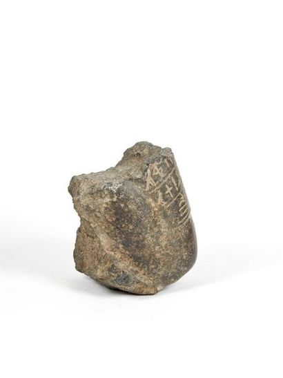 null Knees carved with votive statue. Diorite. Two lines of inscriptions. Late Period...