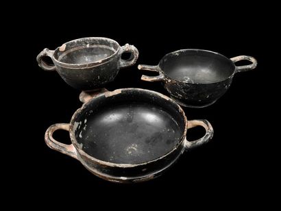 null Three black glazed ceramics, two kylix and one skyphos.
In the Greek state of...