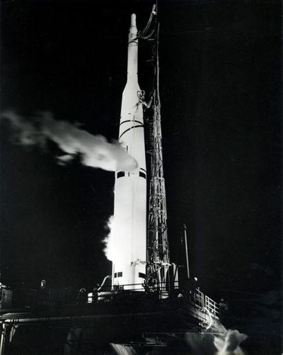 null Superb silhouette of a rocket receiving its fuel load on its launch pad the...
