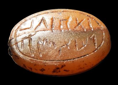 null Perle sceau gravée d’une inscription probablement araméenne ou cananéenne.

Cassé...