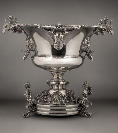 Important silver centrepiece bowl flanked...