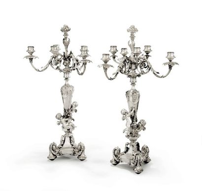 null Pair of six-branched silver
torches Richly chiselled and decorated with two...