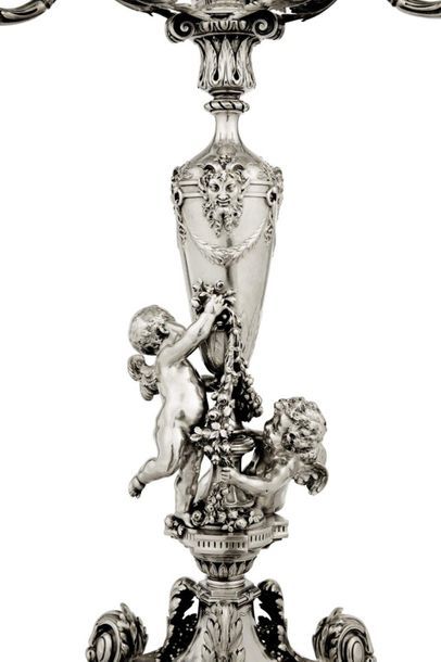 null Pair of six-branched silver
torches Richly chiselled and decorated with two...