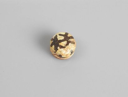 null Bead decorated with a geometrical pattern.glass paste.
First millennia.L :1...