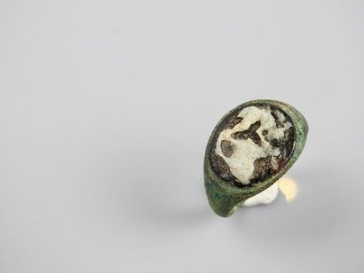 null Bronze ring decorated with a glass paste cameo representing a shepherd and a...