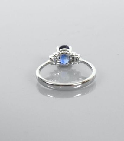 null Ring in white gold, 750 MM, set with an oval sapphire weighing 1.65 carat and...