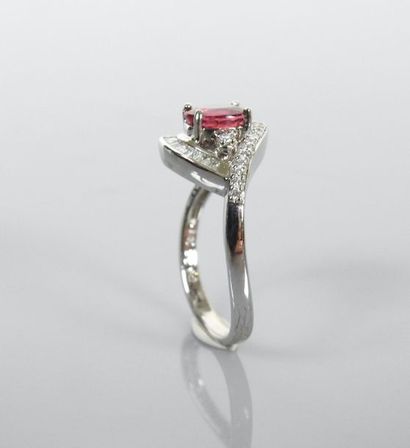 null Asymmetrical ring in white gold, 750 MM, set with an oval ruby weighing 1.07...