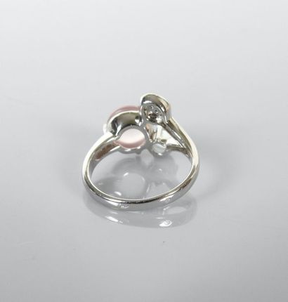 null Ring in white gold, 750 MM, decorated with an aquamarine, a cabochon pink quartz...
